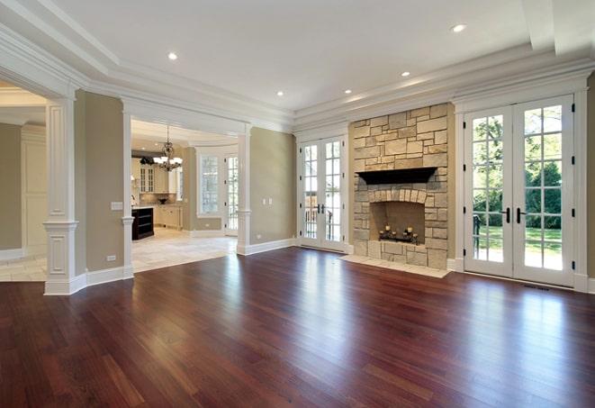 dark, hand-scraped hardwood flooring in a cozy den